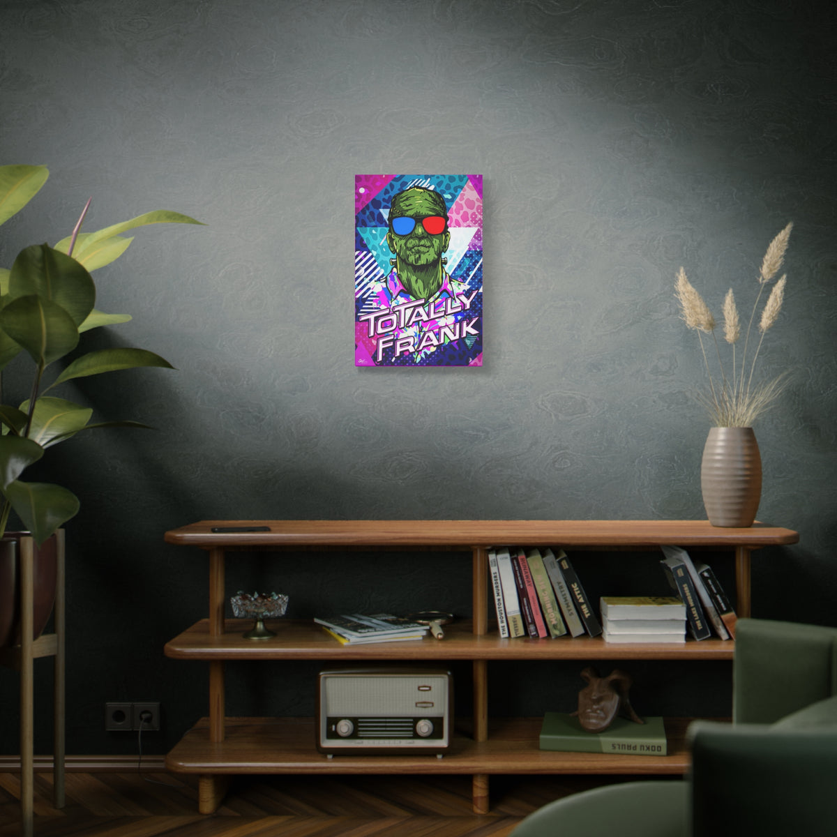 Monster Vibes medium canvas on a green-gray wall over bookshelves, neon pop-art monster with bold block lettering