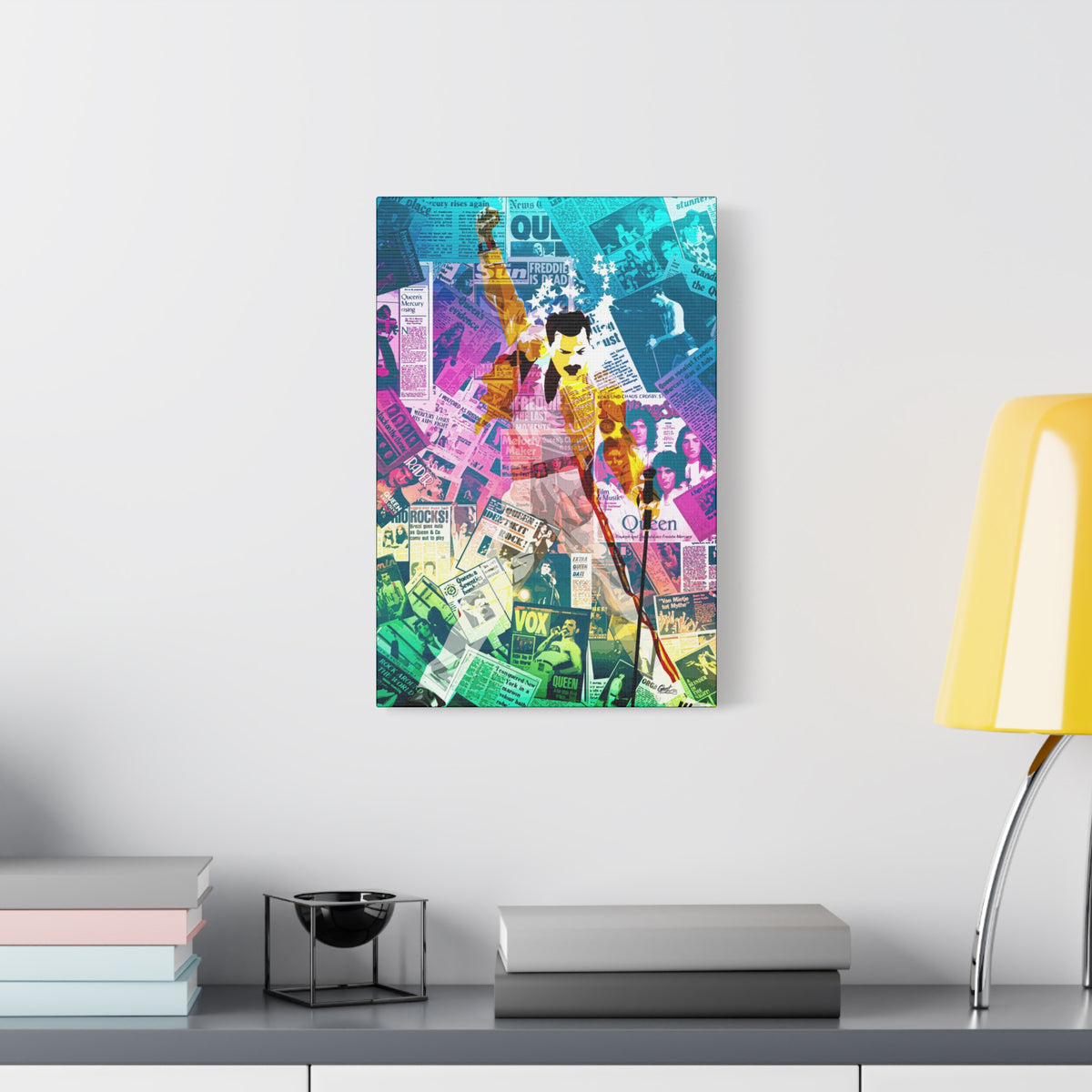 The Showman medium canvas beside a yellow desk lamp, figure in a yellow jacket, fist raised, over newspaper collage
