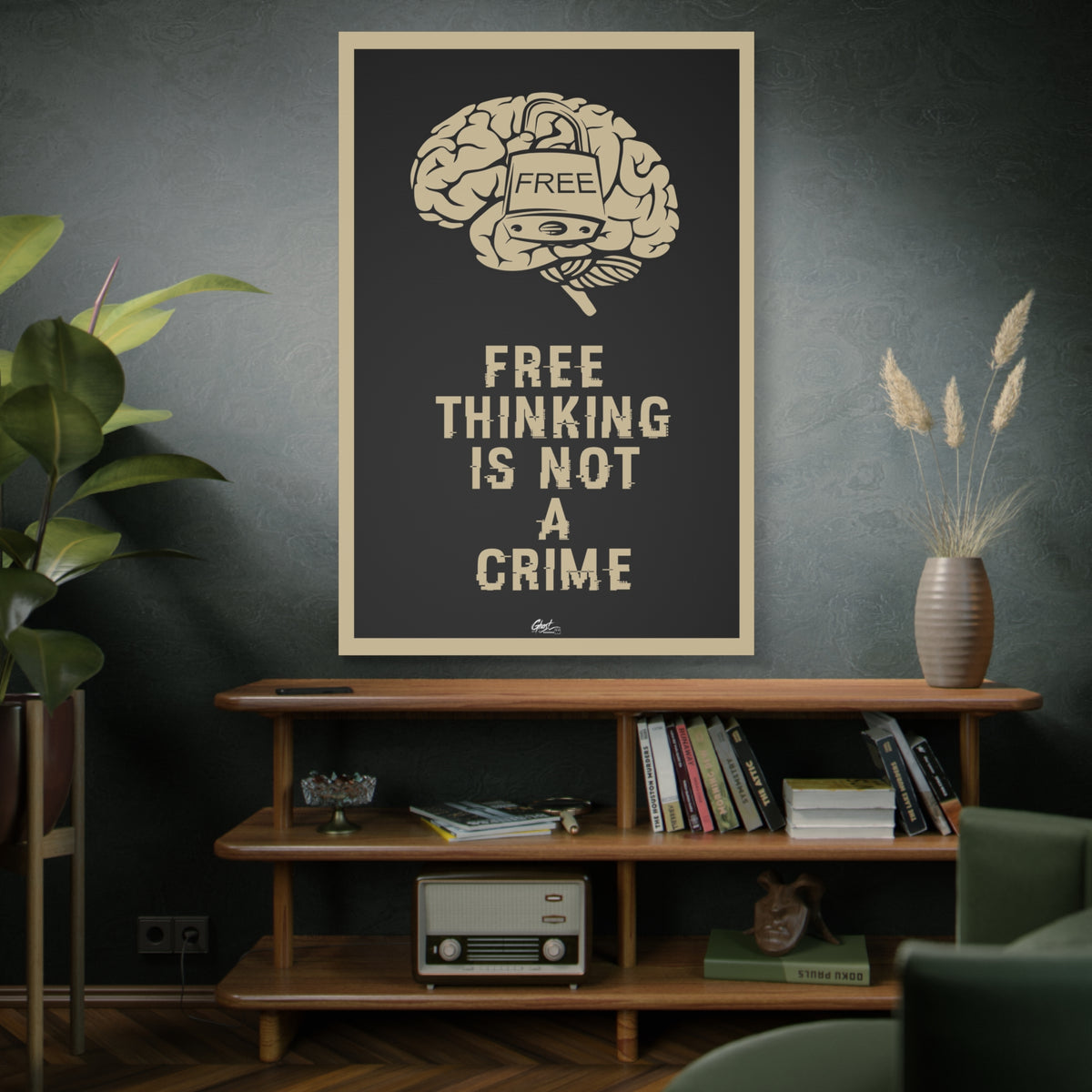 Free Thinking Is Not a Crime oversized canvas on a green-gray wall over bookshelves, padlocked brain in beige on charcoal