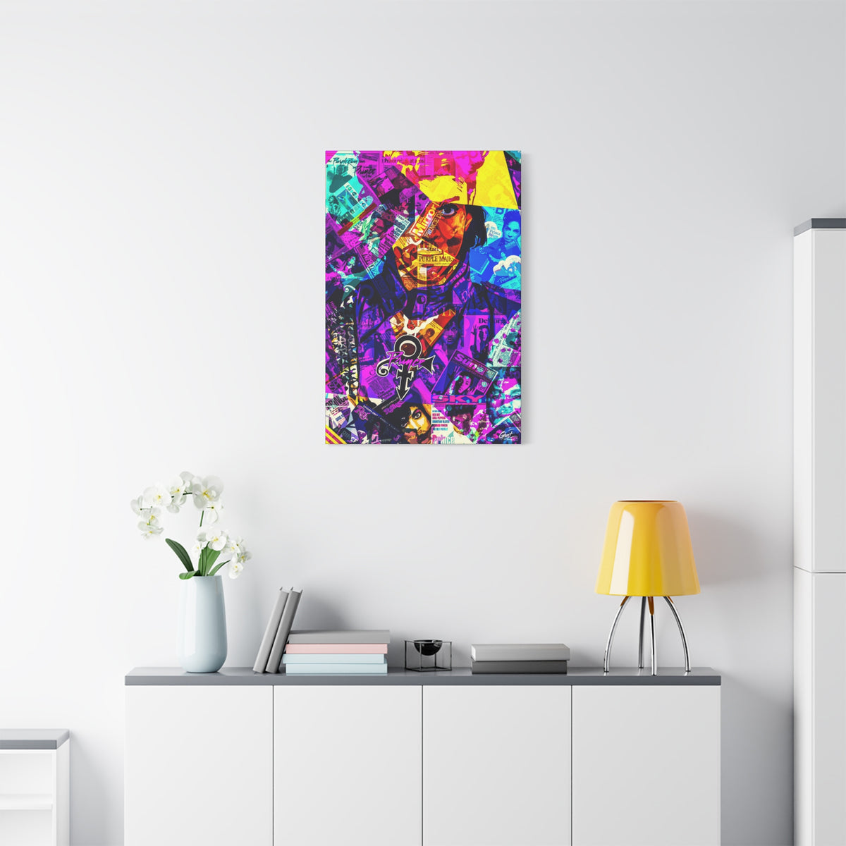 The Symbol canvas above a white sideboard and yellow lamp, portrait in a yellow hat over a purple and teal magazine collage