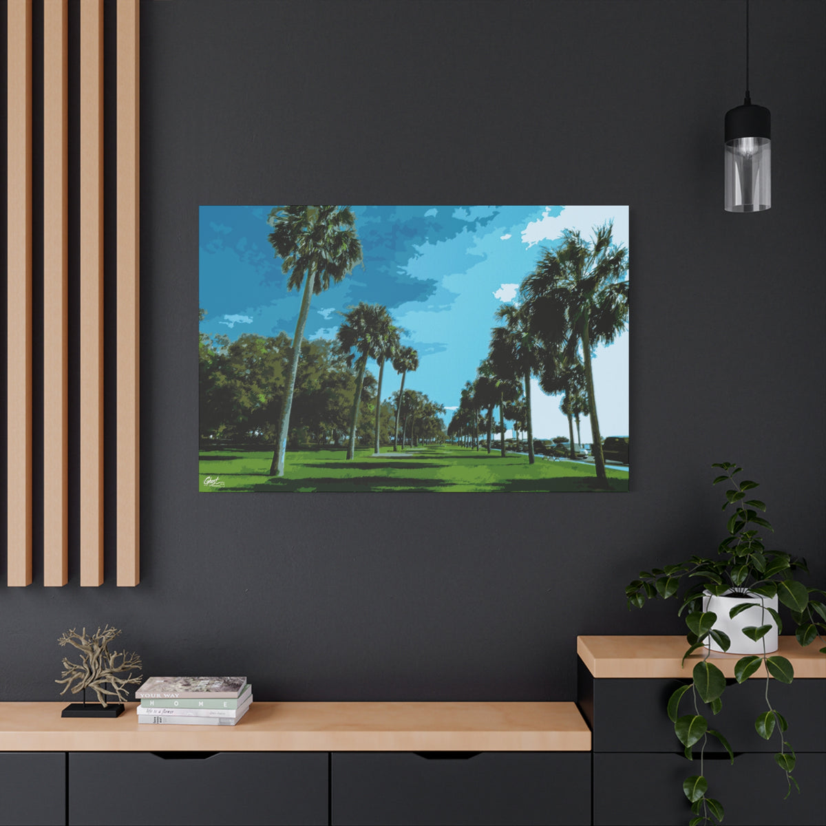 The Battery (Original) large canvas on a charcoal wall over an oak shelf, sunlit palms and long shadows by the water