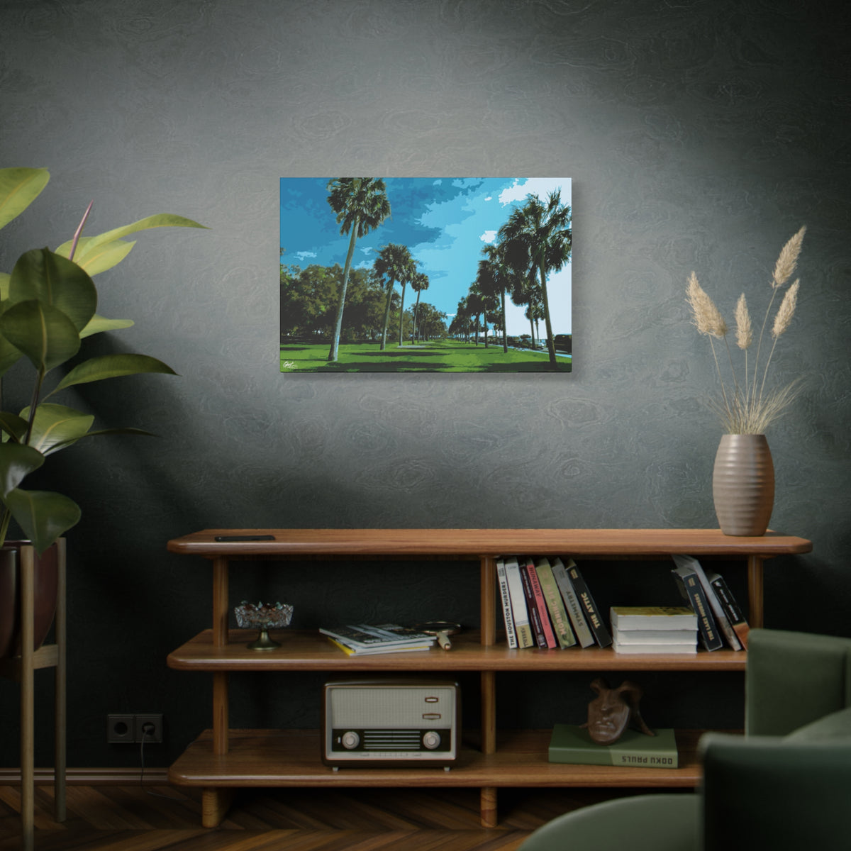 The Battery (Original) canvas on a green-gray wall over bookshelves, tall palms, green lawns and blue sky at the Battery