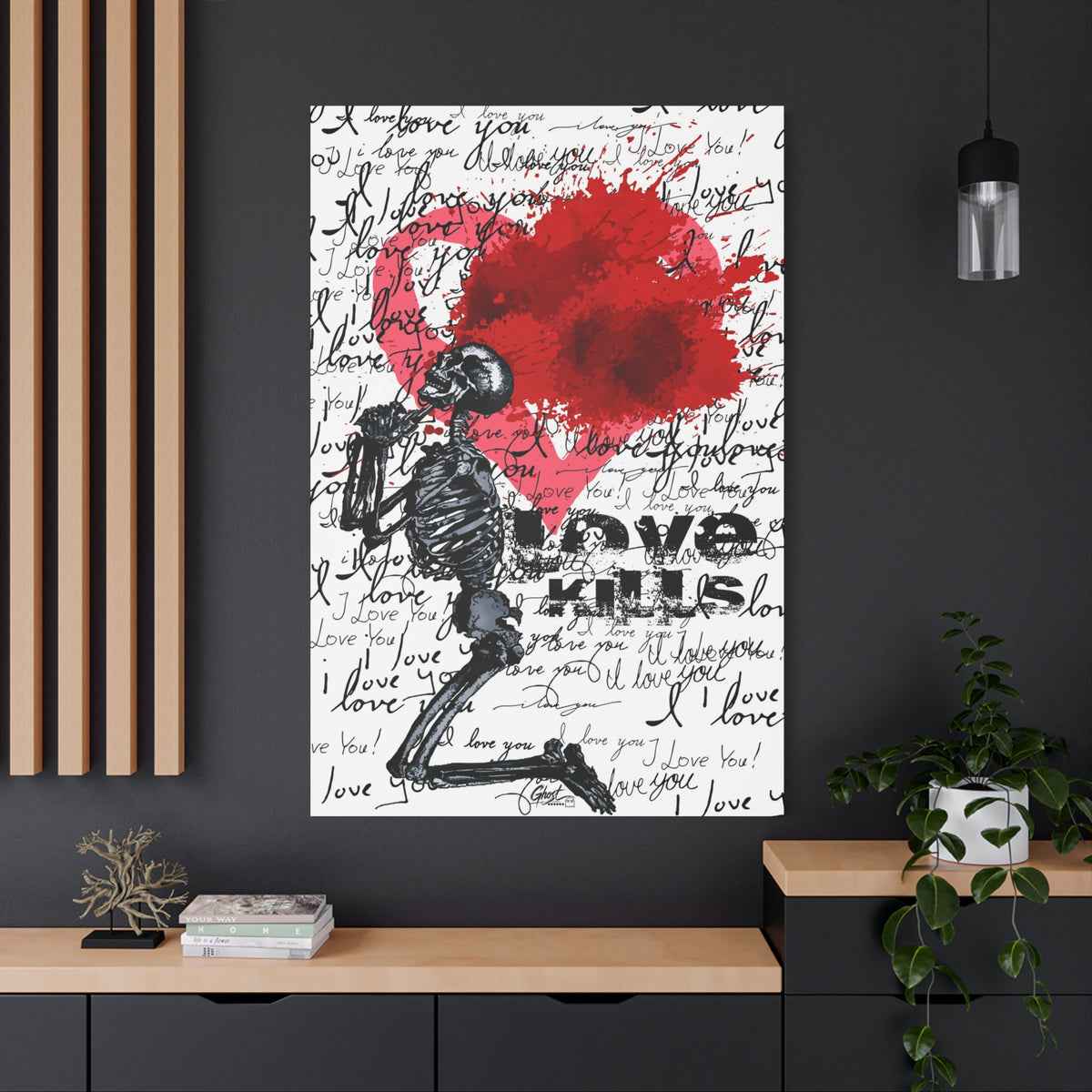 Love Kills oversized canvas on a charcoal wall by wood slats, kneeling skeleton before a burst pink and crimson heart