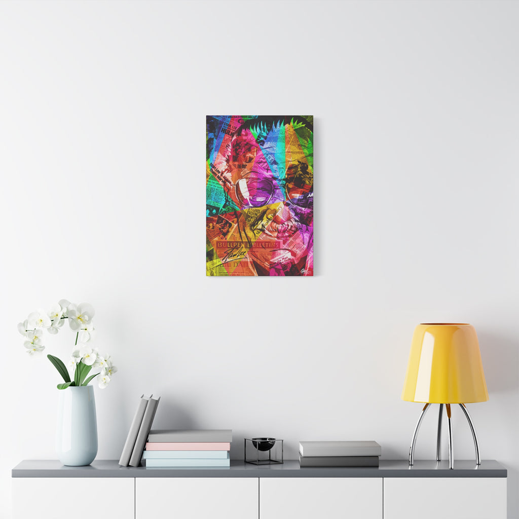 The Man the Myth the Legend canvas over a console with white flowers, grinning collage portrait in pink, green and orange