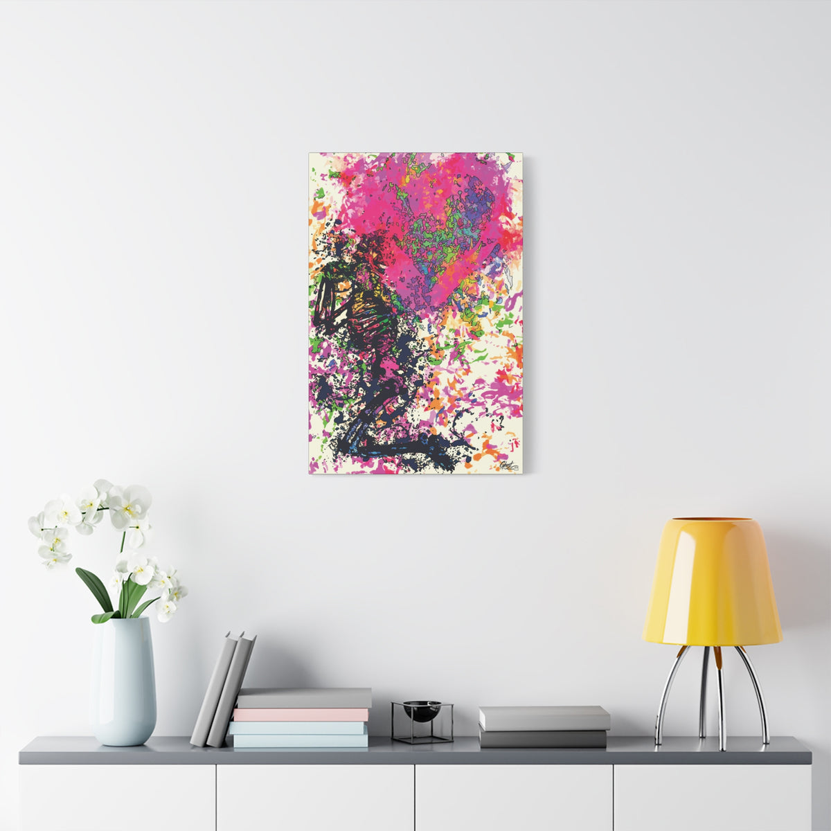 Waiting on My Love medium canvas on a white wall above a console, magenta and black splatter heart with a kneeling figure
