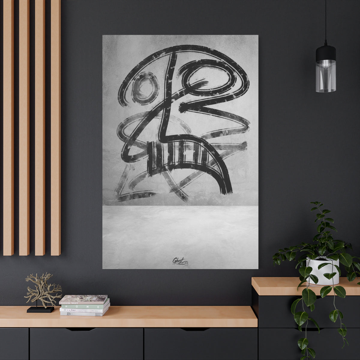 The Mask oversized canvas on a charcoal wall over an oak shelf, smudged charcoal-style abstract face