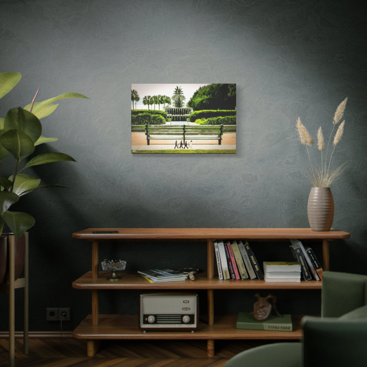Pineapple Crossing medium canvas above a wooden bookshelf, painterly park scene with the pineapple fountain