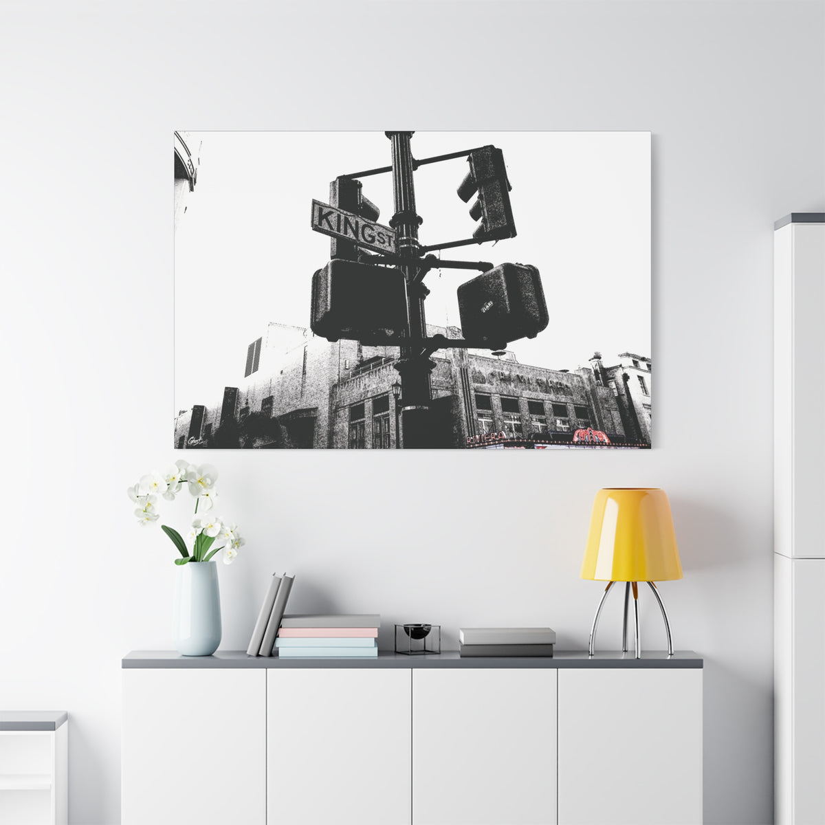 King St large canvas above a white sideboard and yellow lamp, black-and-white King Street signals and the Riviera Theatre
