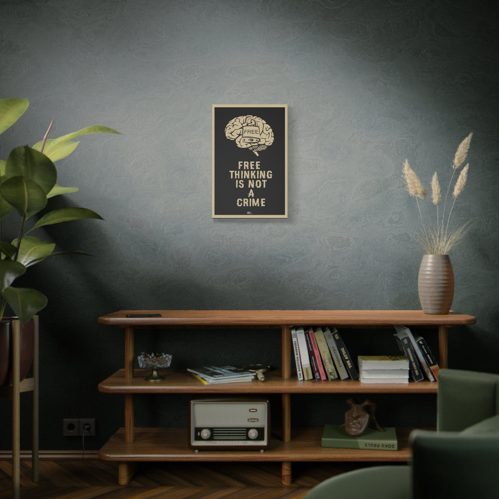 Free Thinking Is Not a Crime small canvas above a wooden bookshelf, Free Thinking Is Not a Crime text with a padlocked brain
