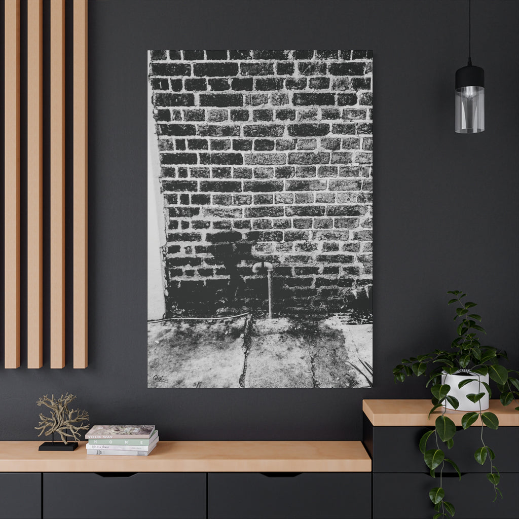 A Little Hiking in Charleston oversized canvas on a charcoal wall over an oak shelf, stencil hiker on old brick