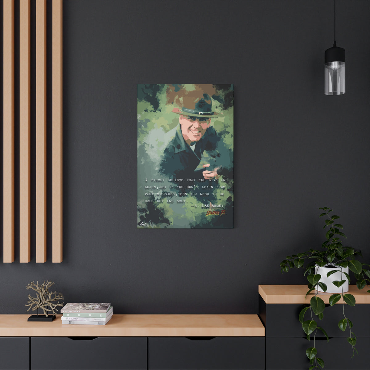 Live and Learn medium canvas on a charcoal wall over an oak shelf, grinning drill instructor in olive and forest green