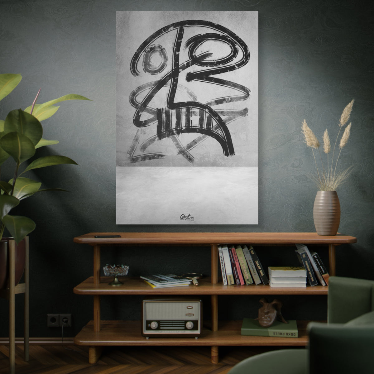 The Mask oversized canvas on a green-gray wall over bookshelves, smudged charcoal-style abstract face