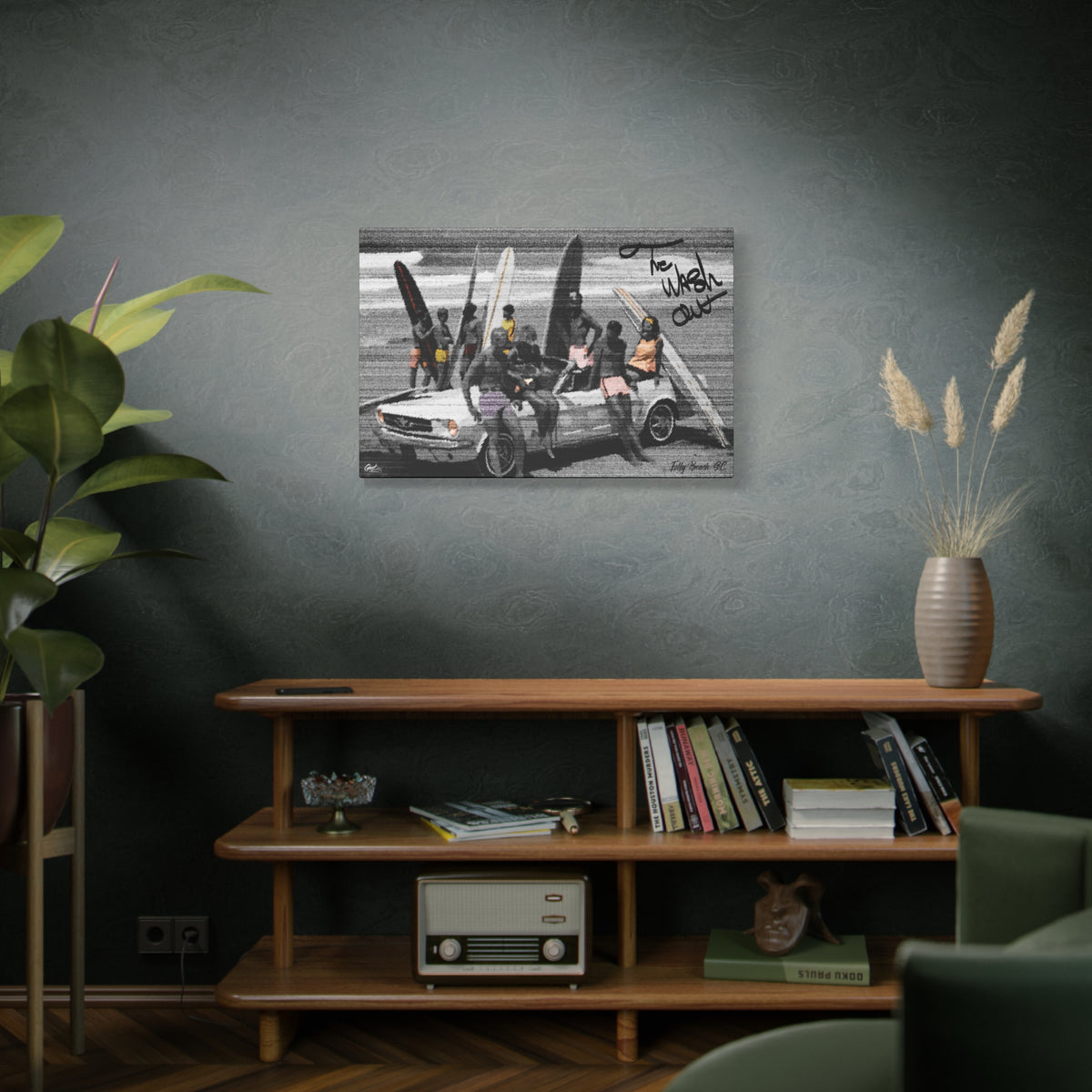 The Wash Out canvas above a wooden bookshelf, friends with surfboards piled on a vintage convertible, black and white