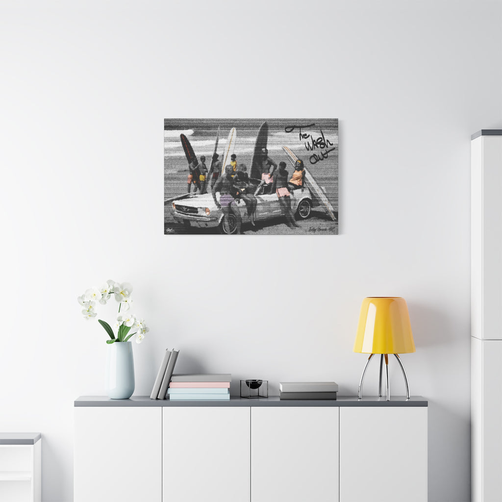 The Wash Out canvas above a white sideboard and yellow lamp, grainy beach-day photo with a surfboard-loaded convertible