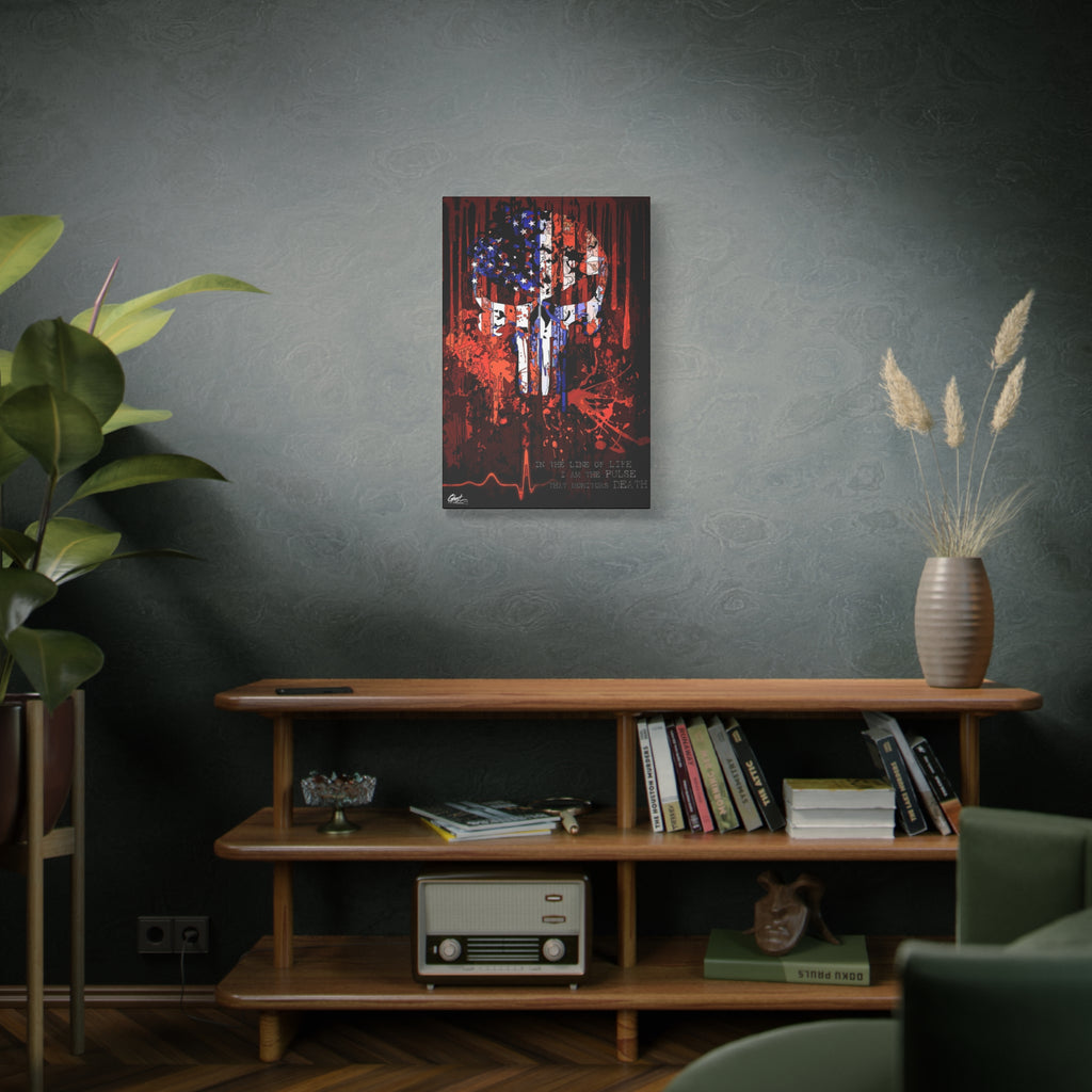 The Vigilante medium canvas on a green-gray wall over bookshelves, skull emblem built from a distressed American flag