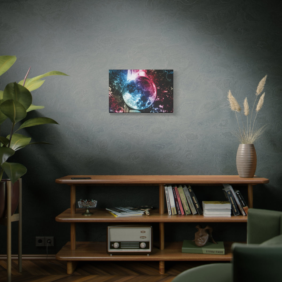 Universe in a Mirror medium canvas above a wooden bookshelf, moon-like orb in blue and pink film tones in a surreal sky