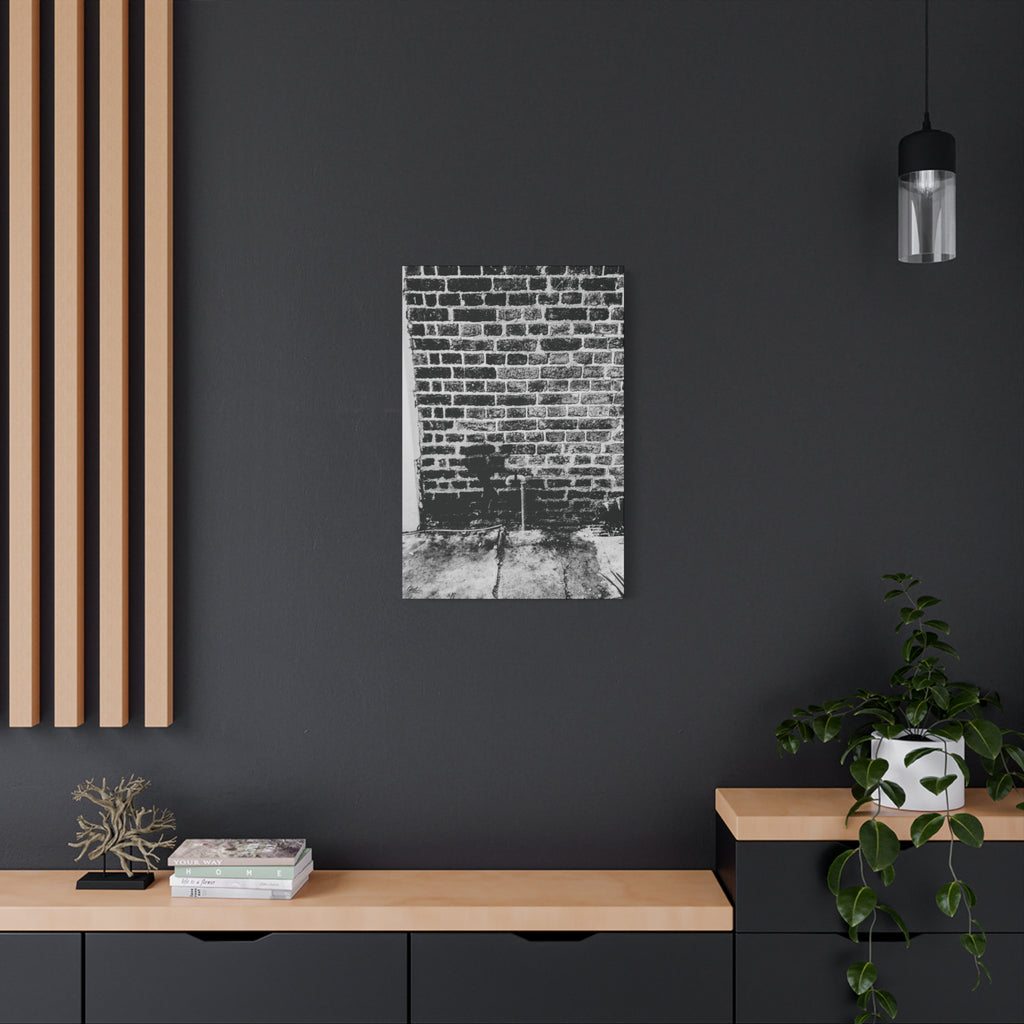 A Little Hiking in Charleston medium canvas on a charcoal wall over an oak shelf, stencil hiker on old brick