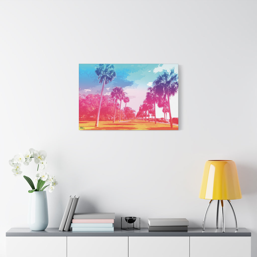 The Battery Tropical Edition oversized canvas on a white wall above a console, palms in a pink and turquoise sunset