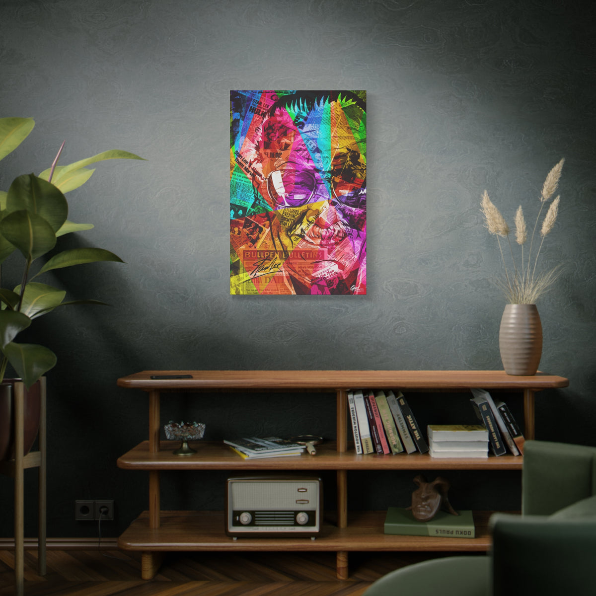 The Man the Myth the Legend large canvas above a wooden bookshelf, grinning collage portrait in pink, green and orange