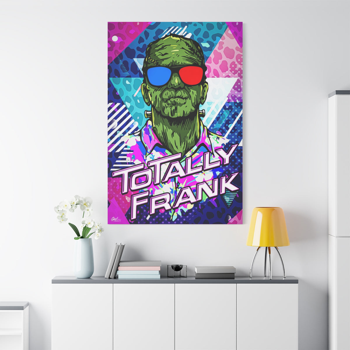 Monster Vibes oversized canvas on a white wall over a sideboard, neon pop-art monster with bold block lettering