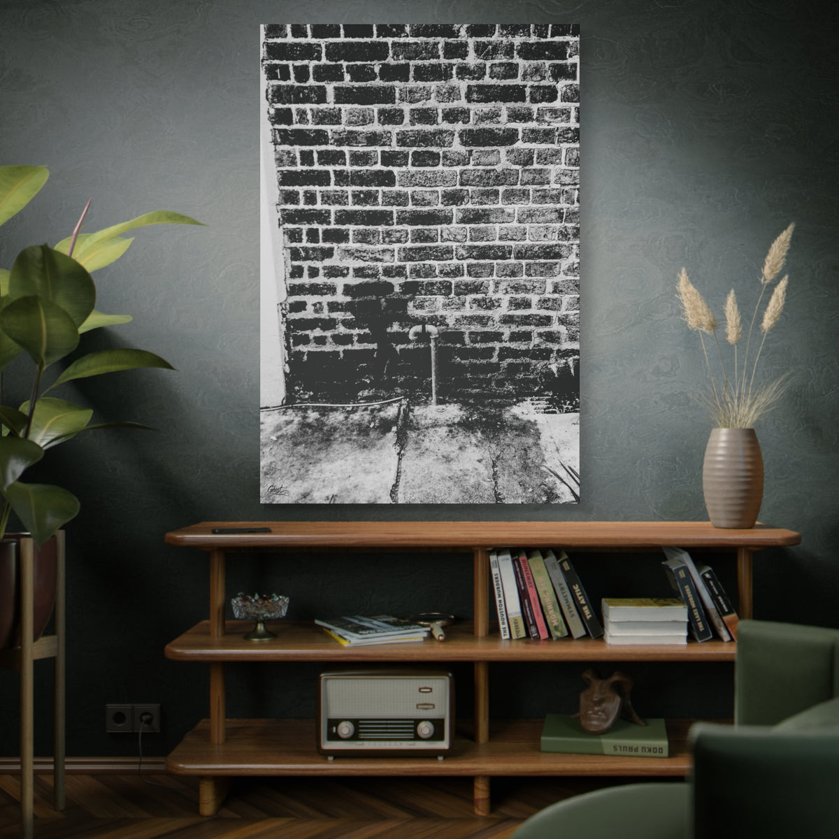 A Little Hiking in Charleston oversized canvas above a wooden bookshelf, high-contrast brick wall with a tiny stencil hiker