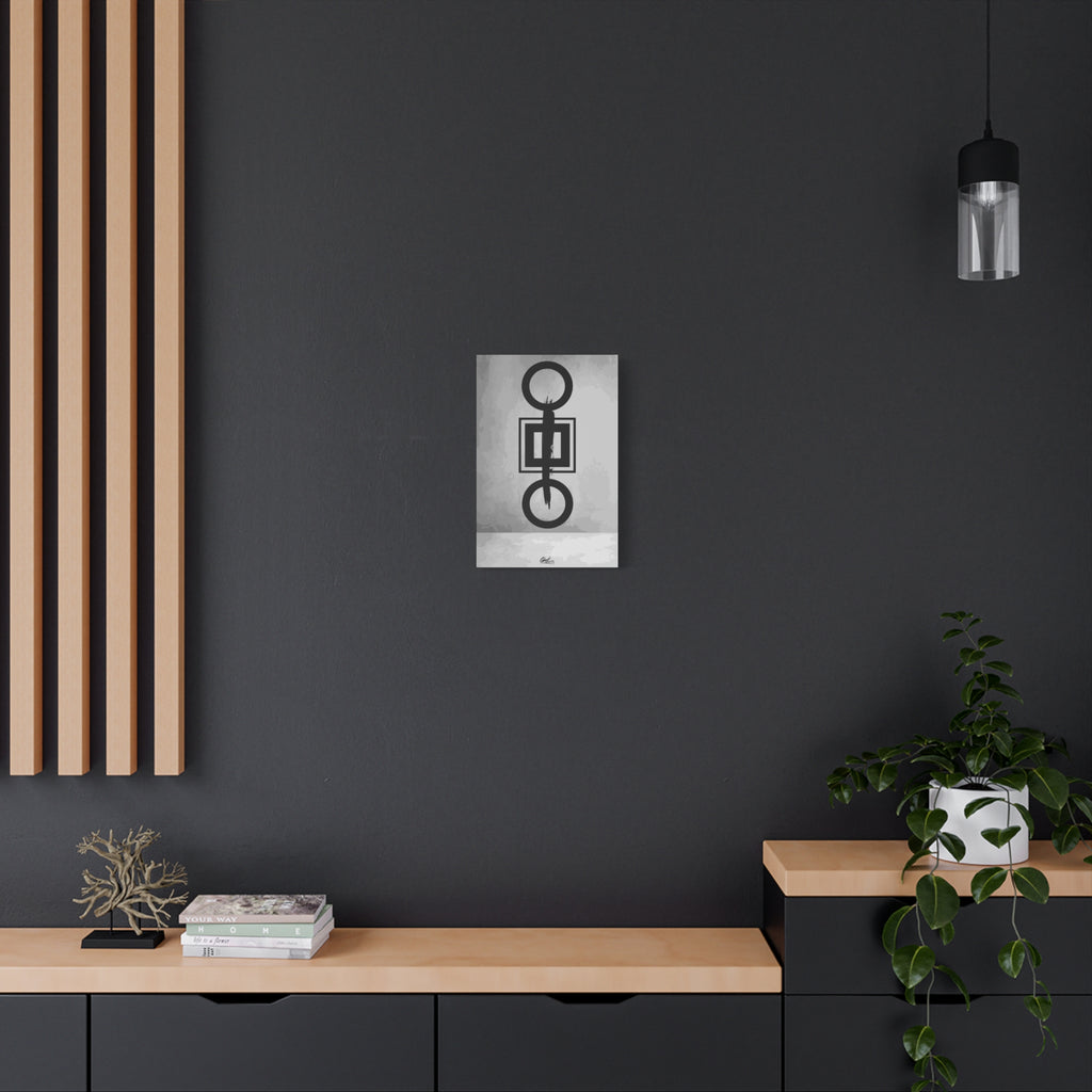 Down is Up small canvas on a charcoal wall over an oak shelf, black-and-white geometric charcoal-style abstract