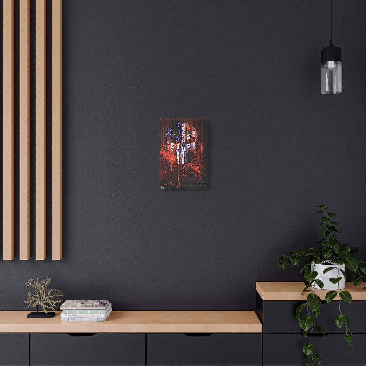 The Vigilante small canvas on a charcoal wall by wood slats, skull emblem built from a distressed American flag