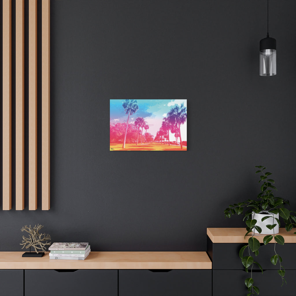 The Battery Tropical Edition medium canvas on a charcoal wall by wood slats, palms in a pink and turquoise sunset