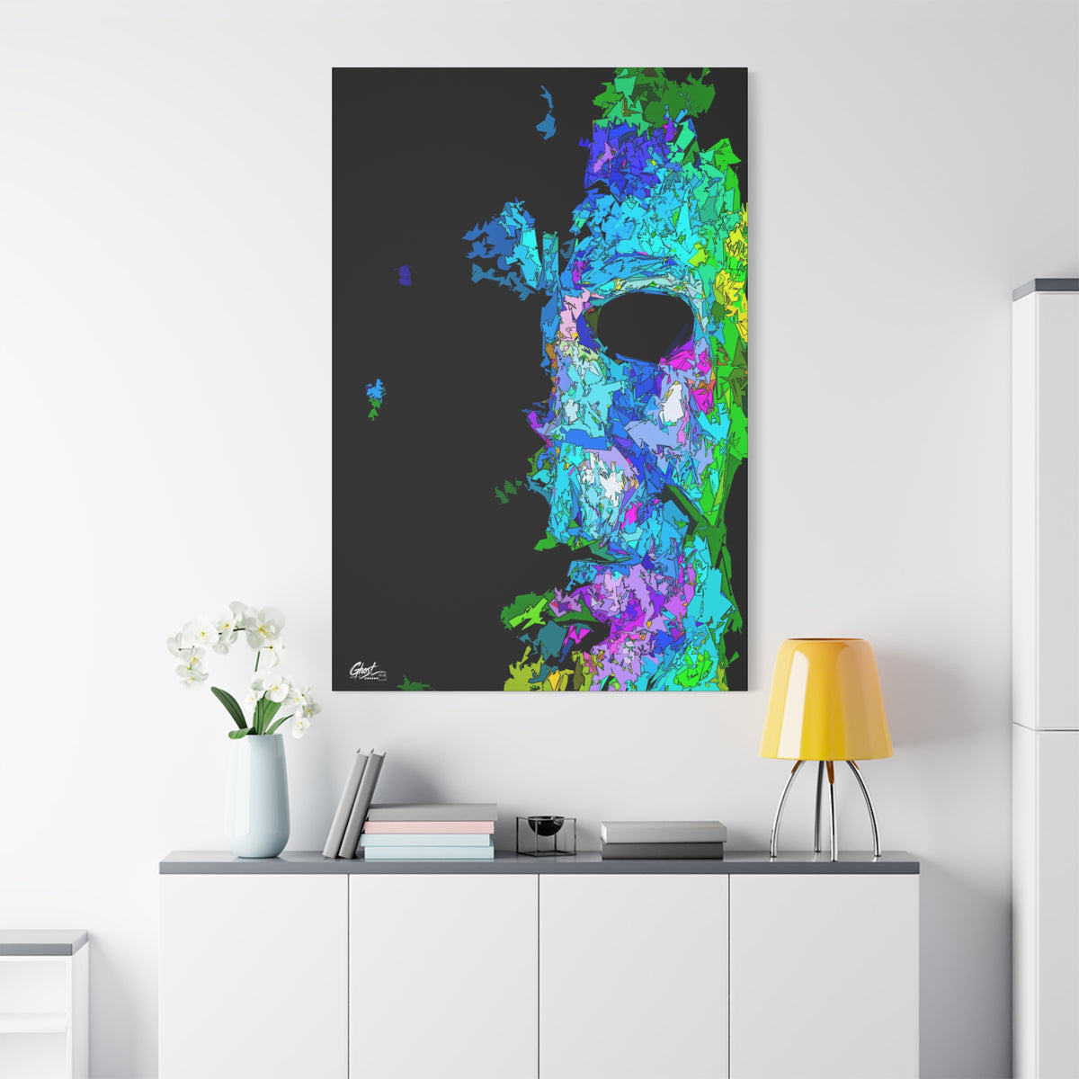 Stalk at Night, Prism Edition canvas on a white wall over a sideboard, fractured triangle mask in electric color on black