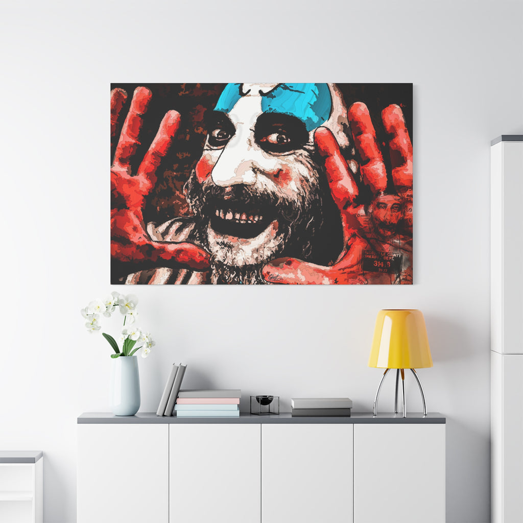 Don't Turn Your Back large canvas above a white sideboard and yellow lamp, high-contrast red and white clown portrait