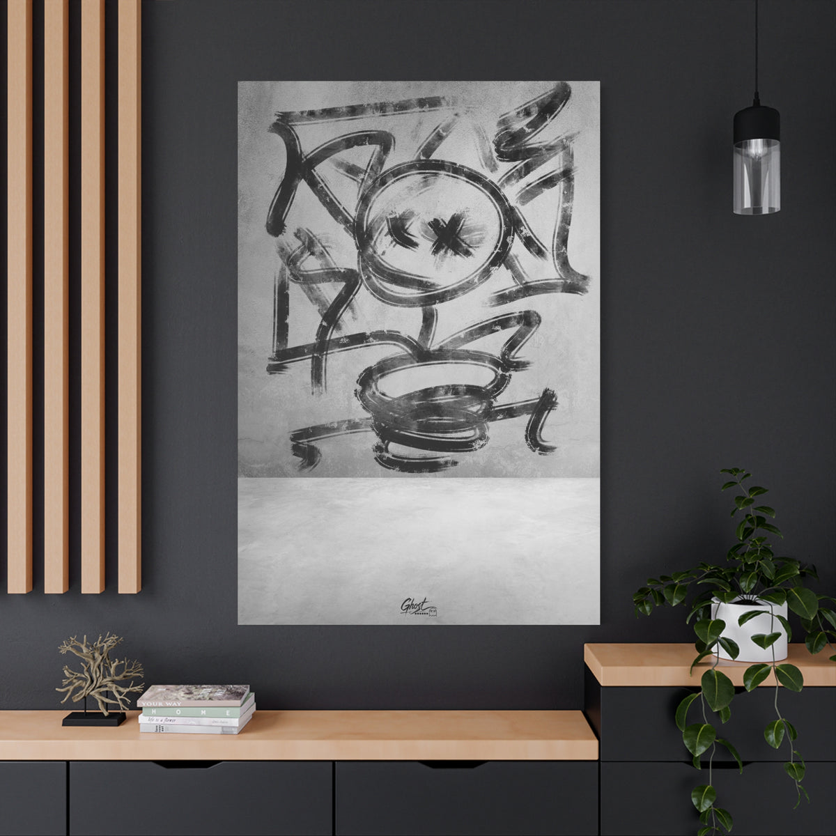 Going Crazy oversized canvas on a charcoal wall over an oak shelf, spiraling charcoal-style abstract in black and white
