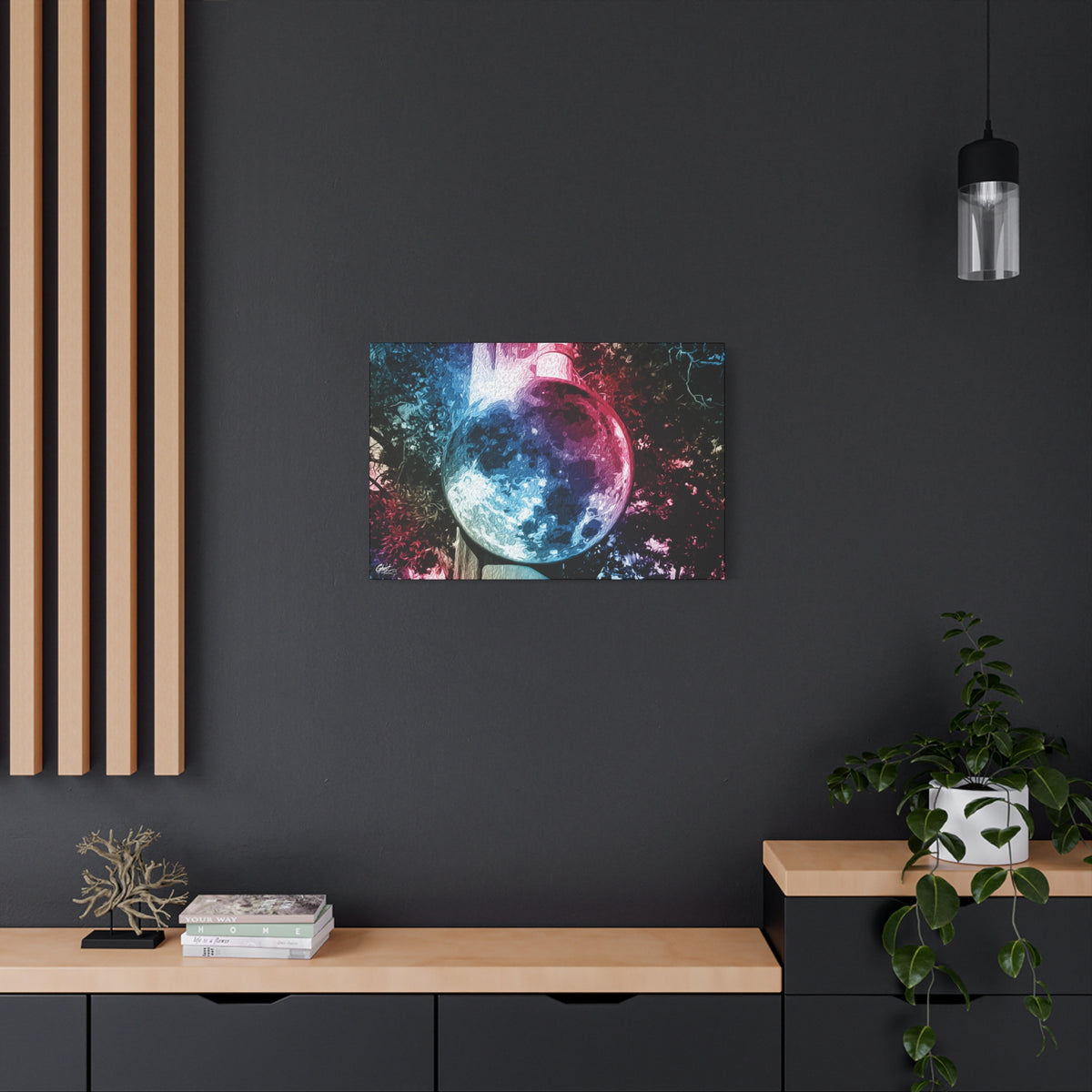 Universe in a Mirror medium canvas on a charcoal wall by wood slats, glowing mirrored orb floating in a dreamy pink-blue sky