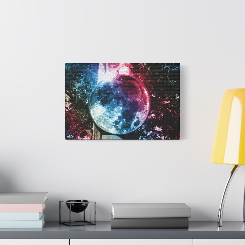 Universe in a Mirror oversized canvas beside a yellow desk lamp, moon-like orb in blue and pink film tones in a surreal sky