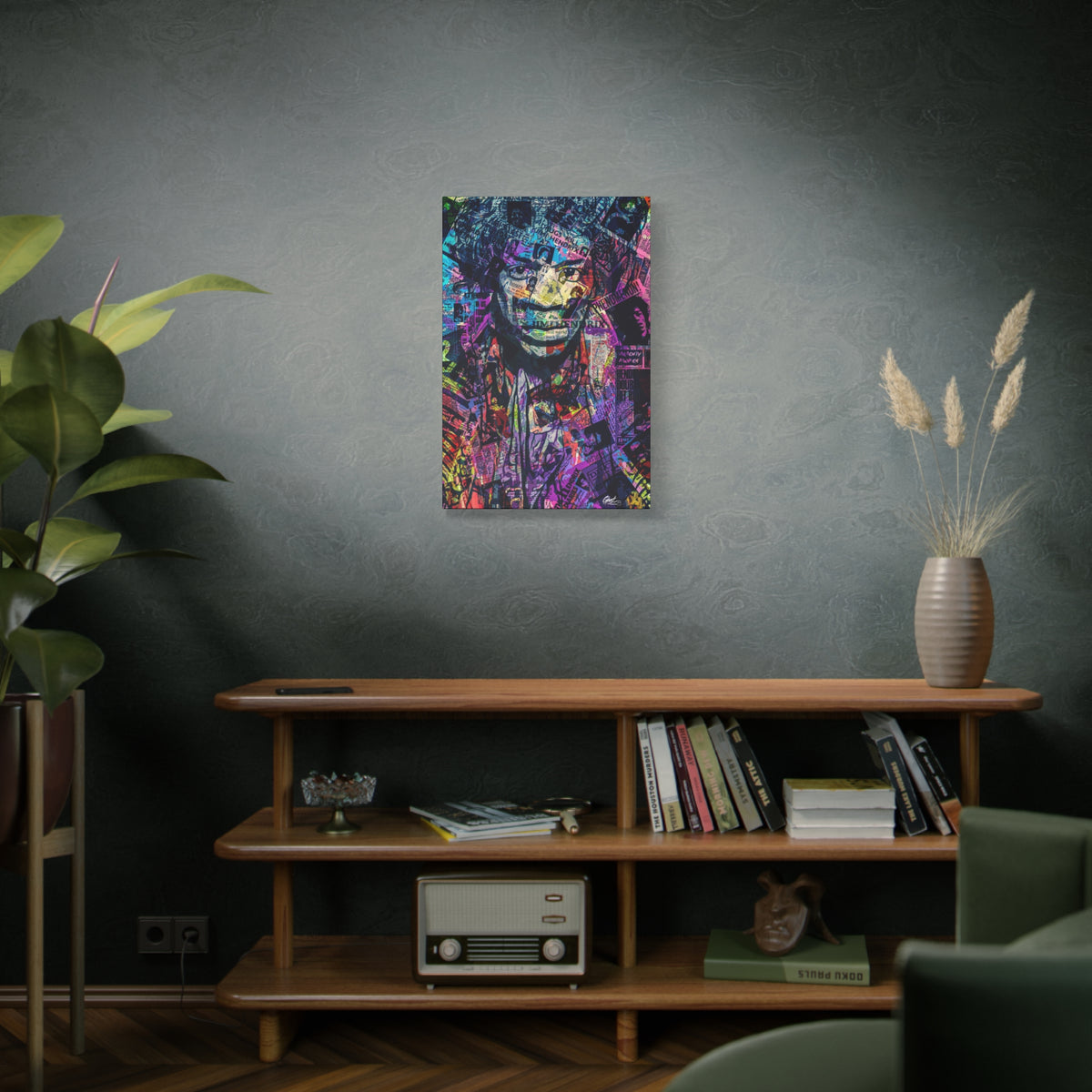 Purple Voodoo medium canvas on a green-gray wall over bookshelves, haloed face in a blue, purple and pink newspaper collage
