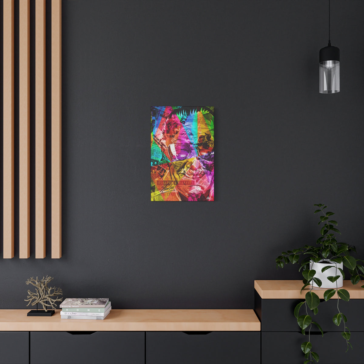 The Man the Myth the Legend canvas on a charcoal wall over an oak shelf, grinning collage portrait in pink, green and orange