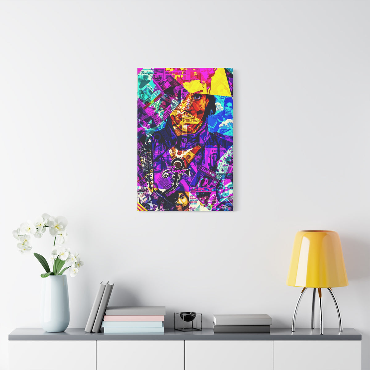 The Symbol large canvas on a white wall above a console, vibrant collage portrait in magenta and gold