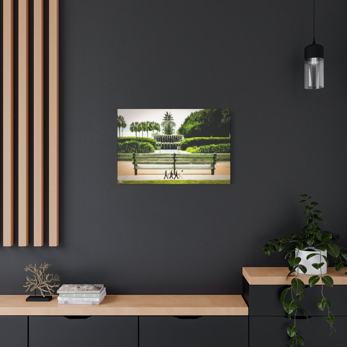 Pineapple Crossing medium canvas on a charcoal wall over an oak shelf, pineapple fountain and four walkers
