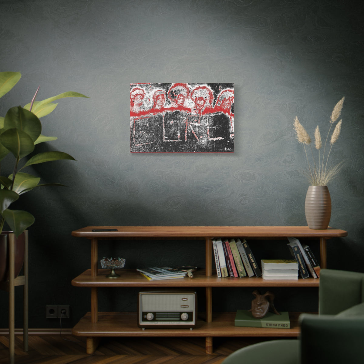 Lowcountry Medicine medium canvas on a green-gray wall over bookshelves, red-outlined faces over engraved lettering in a grungy sidewalk