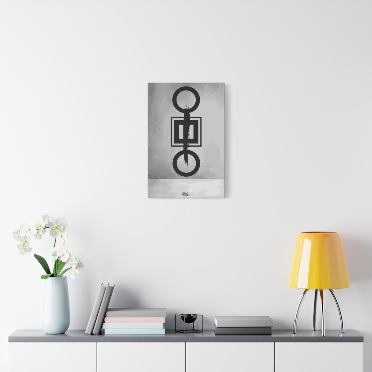 Down is Up small canvas over a console with white flowers, circles and squares crossed by a bold black brushstroke