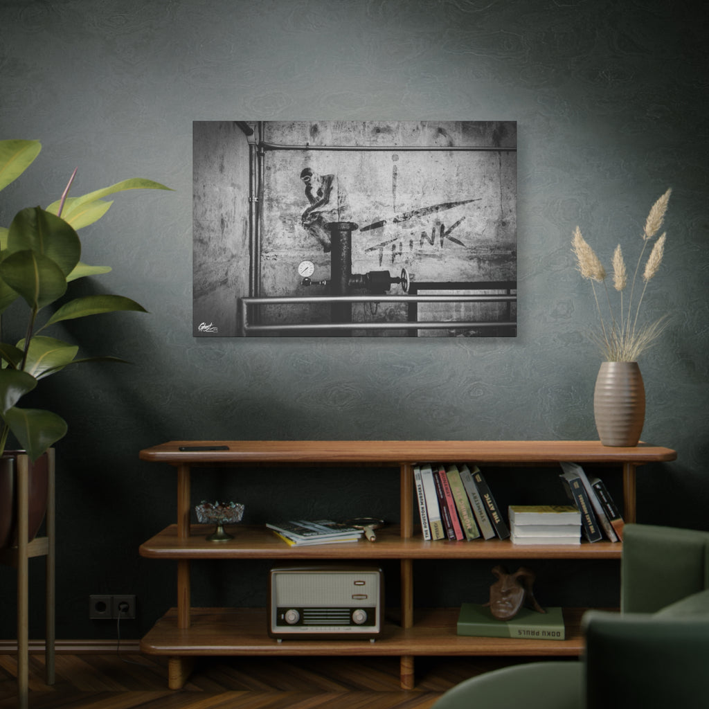I Overthink large canvas on a green-gray wall over bookshelves, gritty parking-garage wall with a stenciled THINK