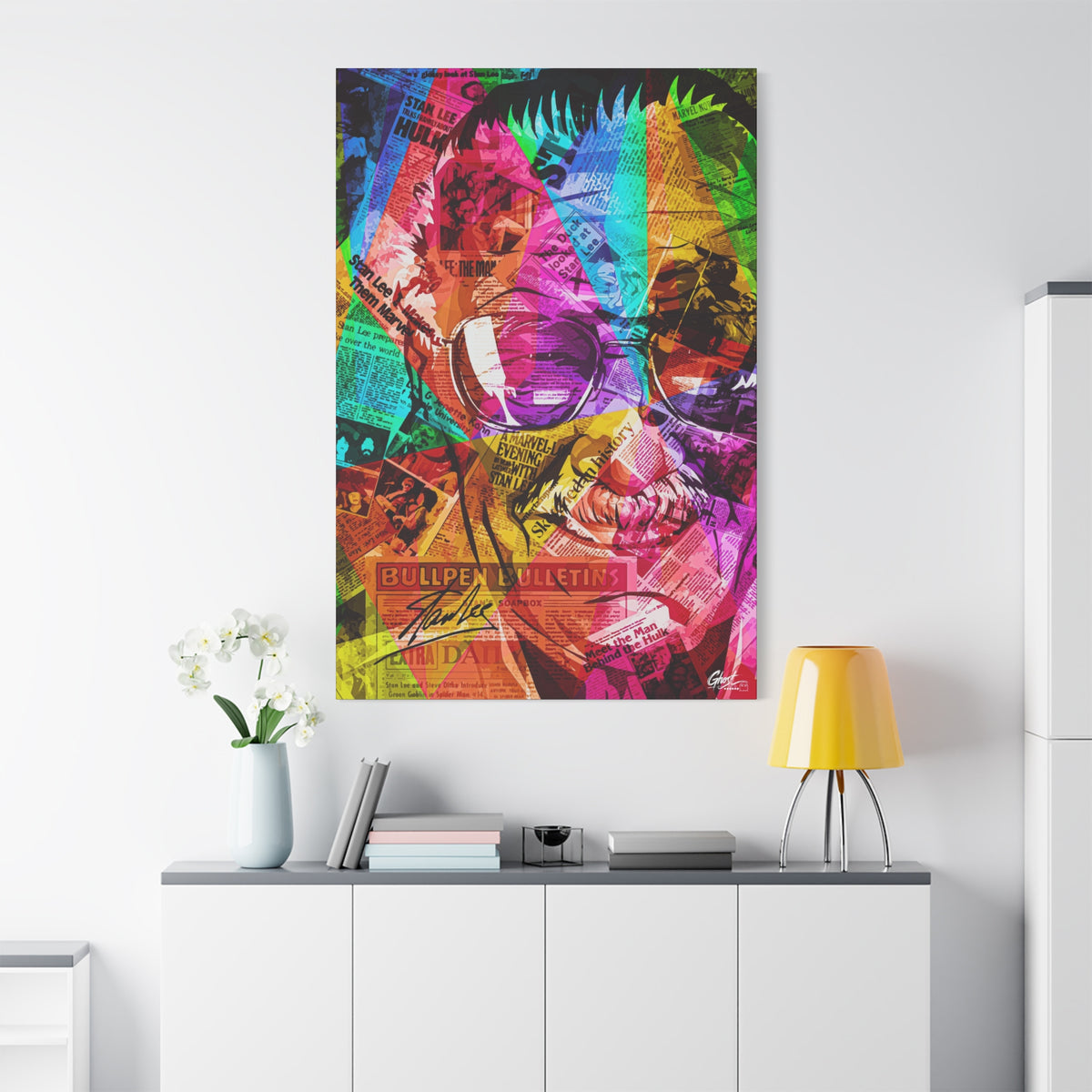 The Man the Myth the Legend canvas on a white wall over a sideboard, grinning collage portrait in pink, green and orange