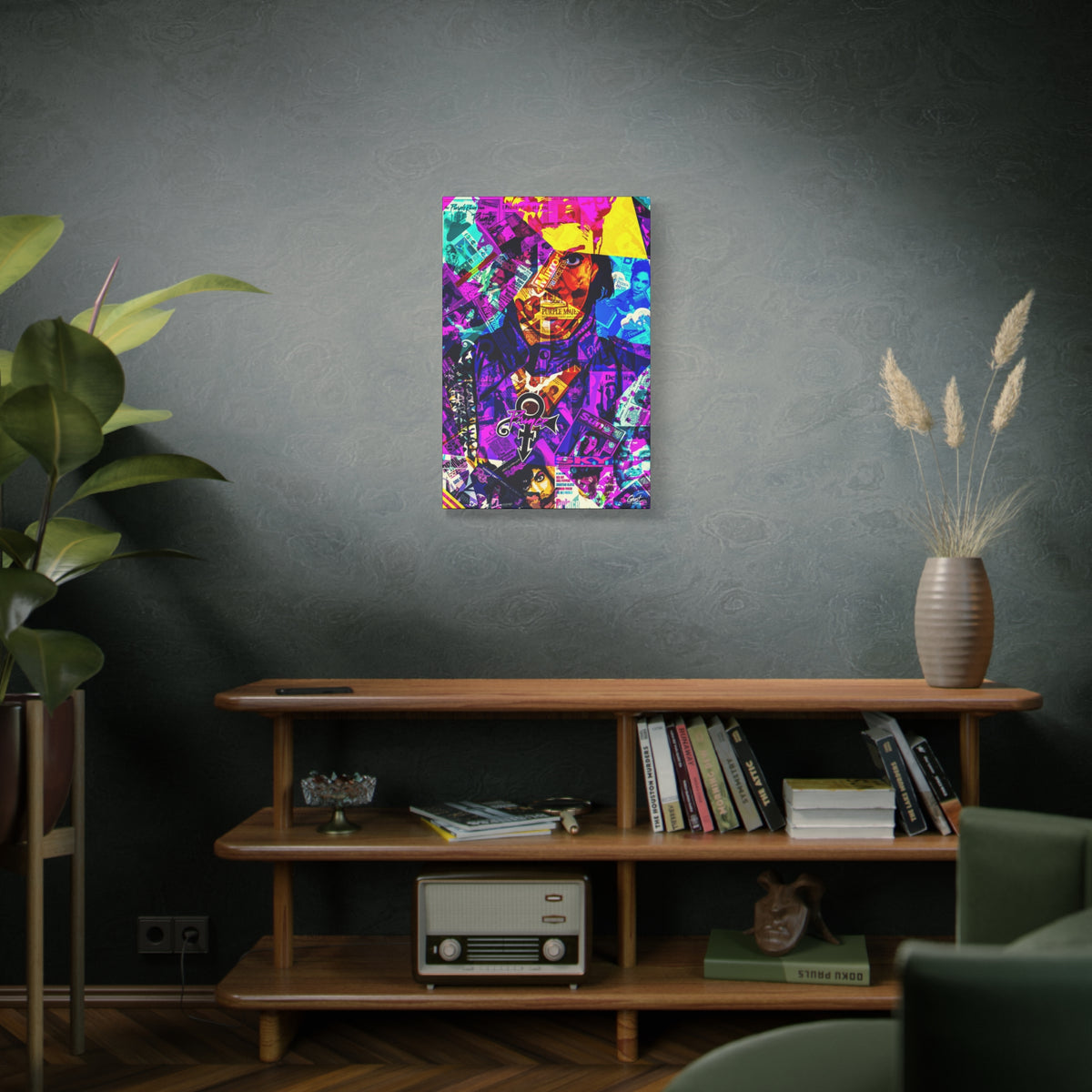 The Symbol canvas on a green-gray wall over bookshelves, portrait in a yellow hat over a purple and teal magazine collage