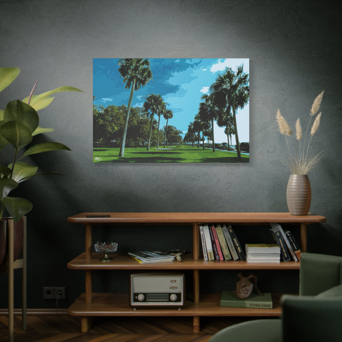 The Battery (Original) large canvas above a wooden bookshelf, tall palms, green lawns and blue sky at the Battery