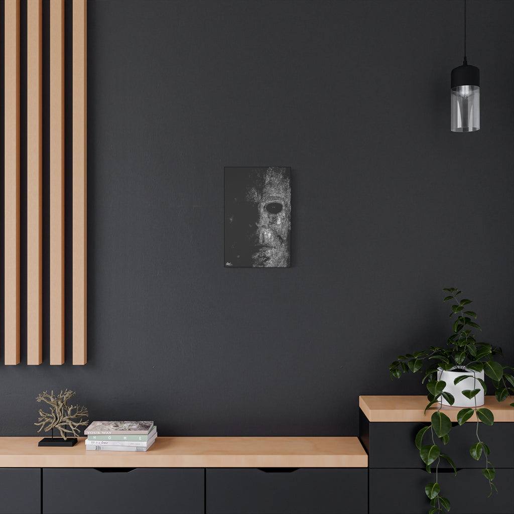 Stalk at Night small canvas on a charcoal wall over an oak shelf, scratchy pen-and-ink mask emerging from darkness