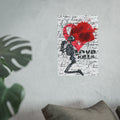 Love Kills art poster on a light gray wall beside a monstera plant