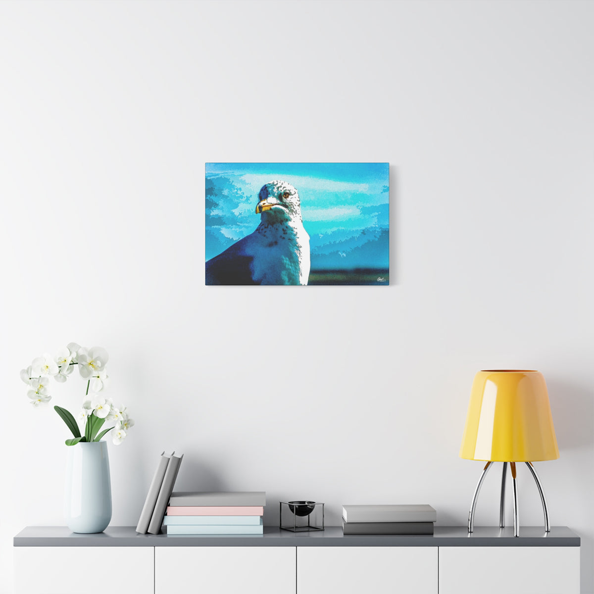 Carolina Seagull canvas over a console with white flowers, close-up seagull with a sharp eye and yellow beak on bright blue