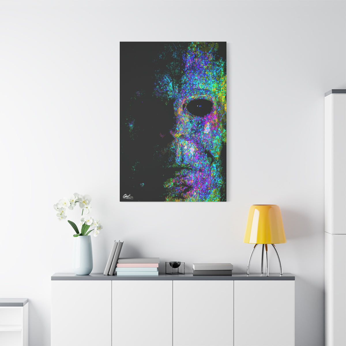 Stalk at Night, Neon Edition large canvas above a white sideboard and yellow lamp, half-shadowed mask in colorful sketch lines