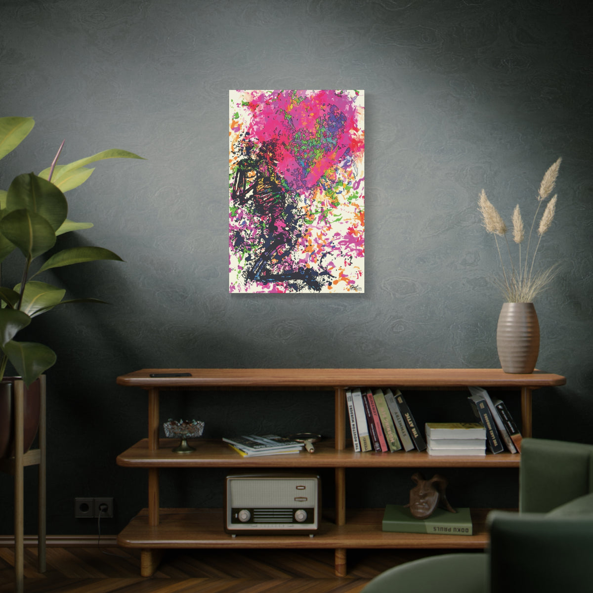 Waiting on My Love canvas above a wooden bookshelf, kneeling skeletal figure under a fuchsia splatter heart