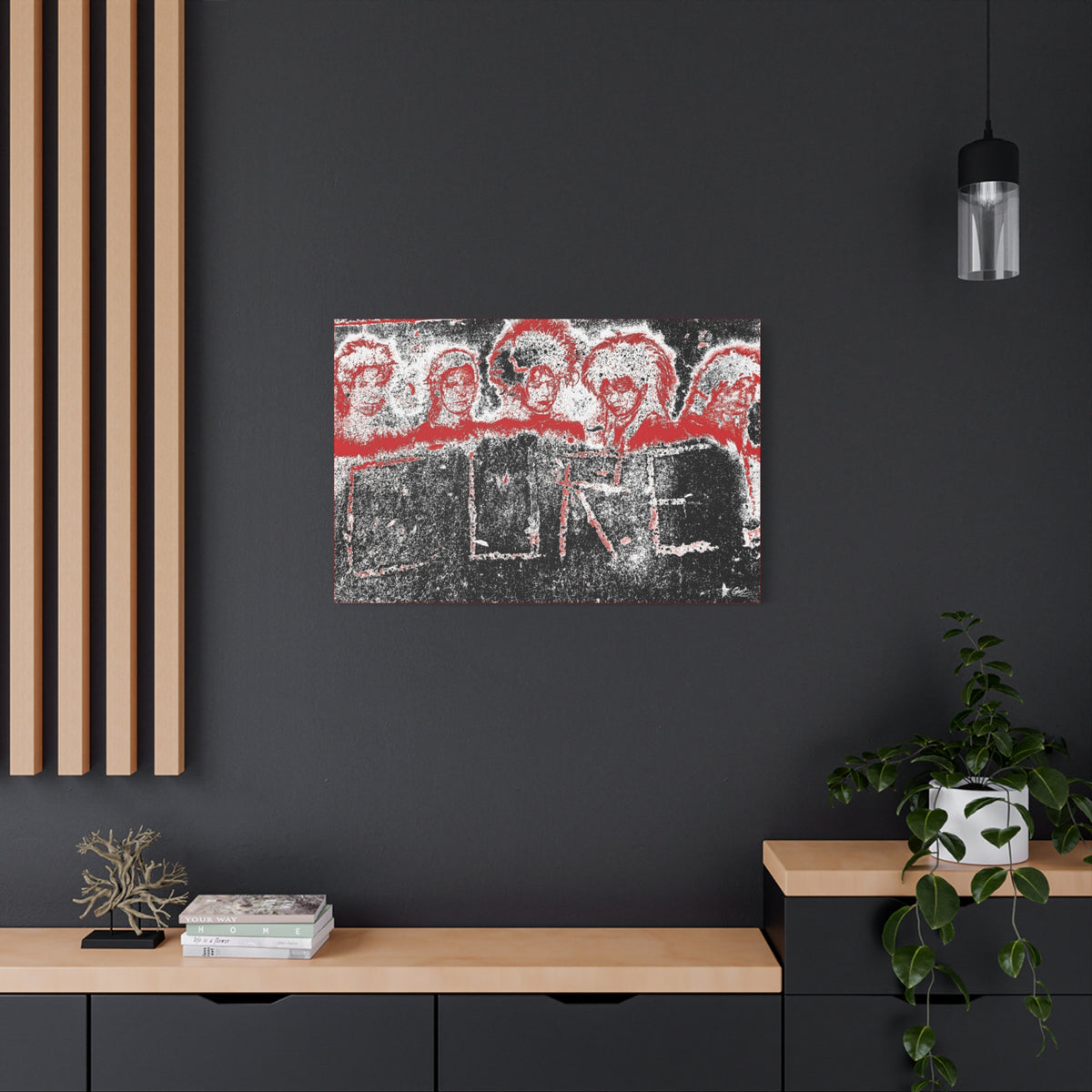 Lowcountry Medicine medium canvas on a charcoal wall over an oak shelf, red-outlined faces over engraved lettering in a grungy sidewalk