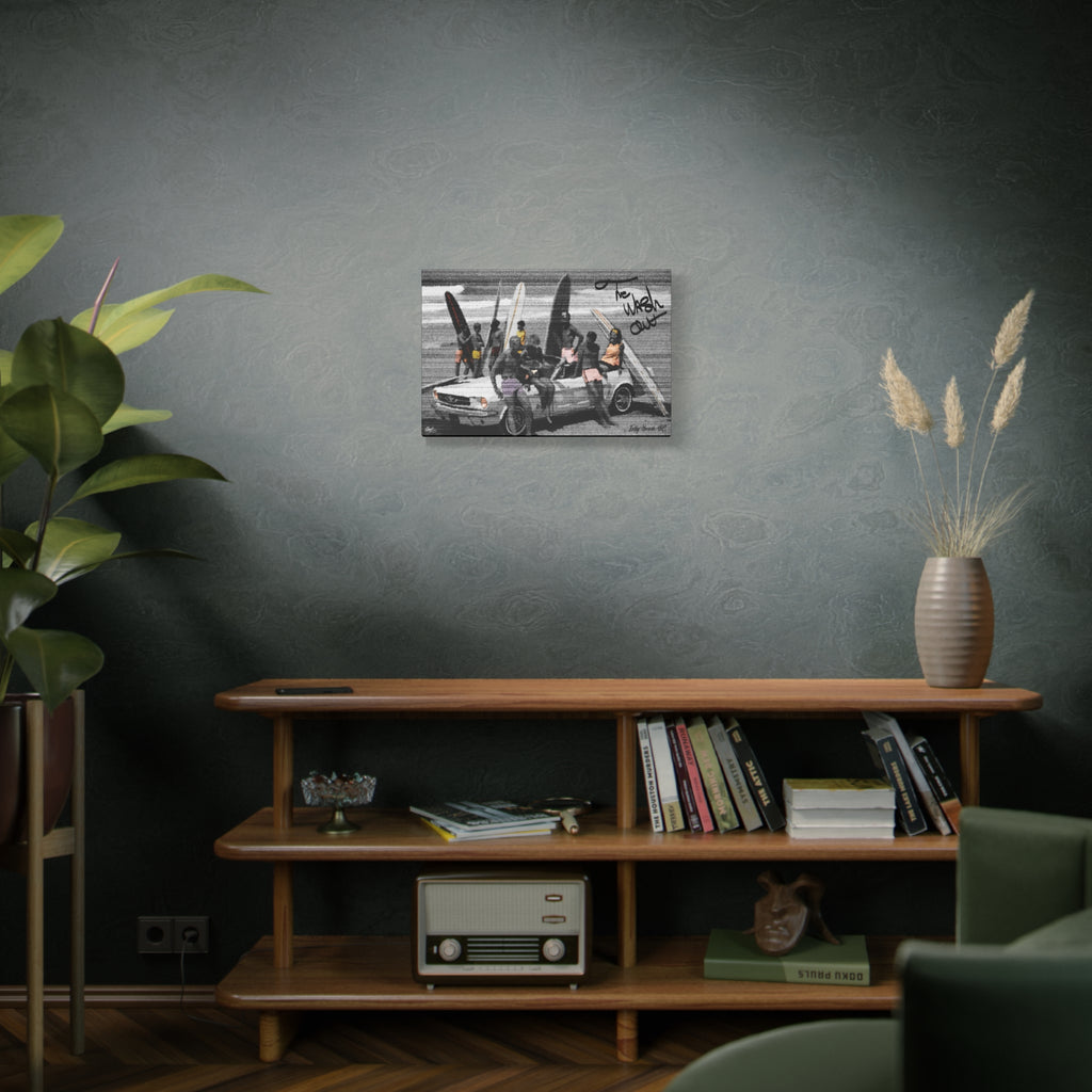 The Wash Out small canvas above a wooden bookshelf, grainy beach-day photo with a surfboard-loaded convertible